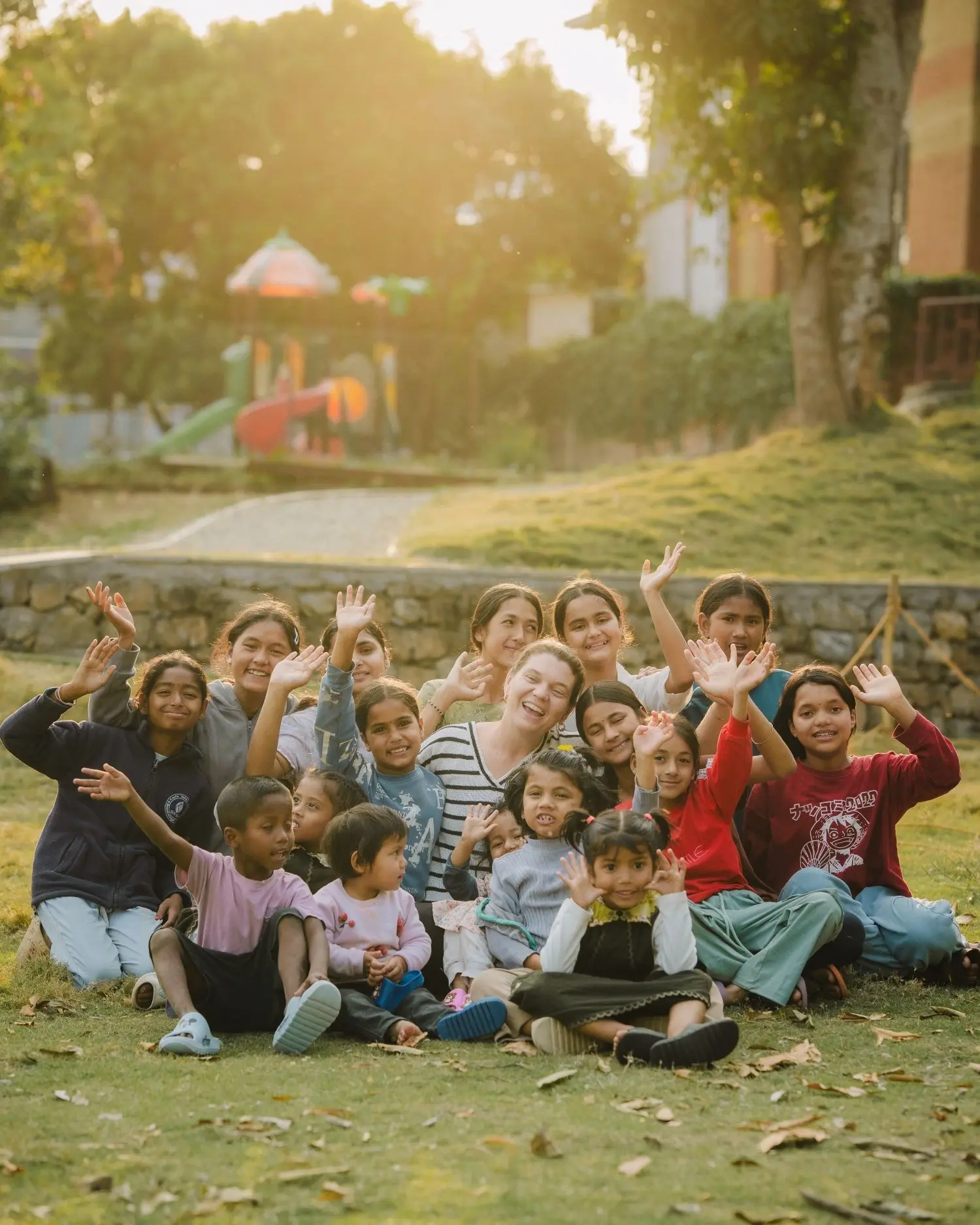 Children from the BlinkNow community gathered together outdoors in Nepal.